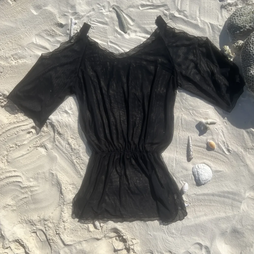 Stylish black Kendall Short Kaftan Cover Up for summer beachwear.