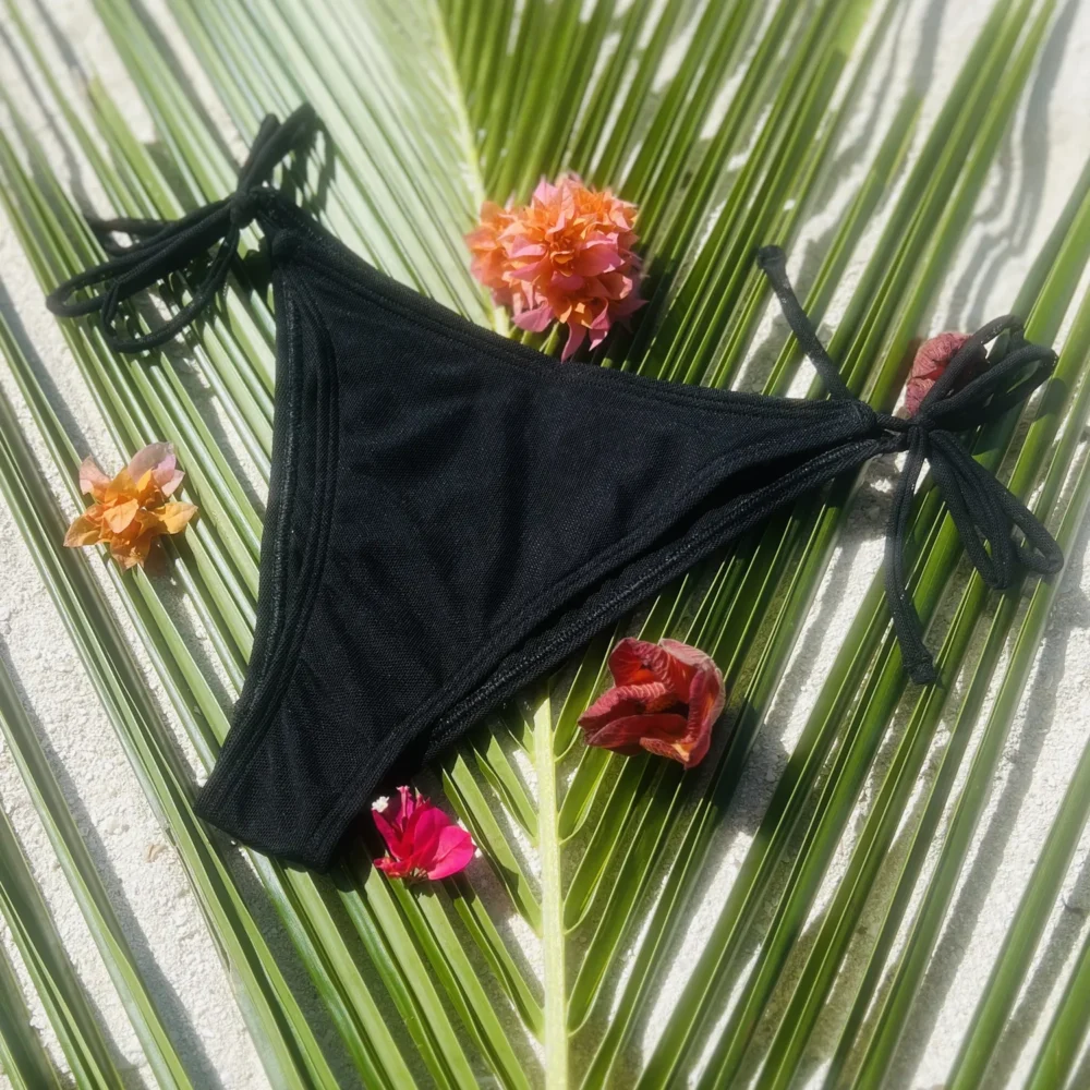 Stylish Riley Bottom swimwear with adjustable tie sides for a customizable fit.